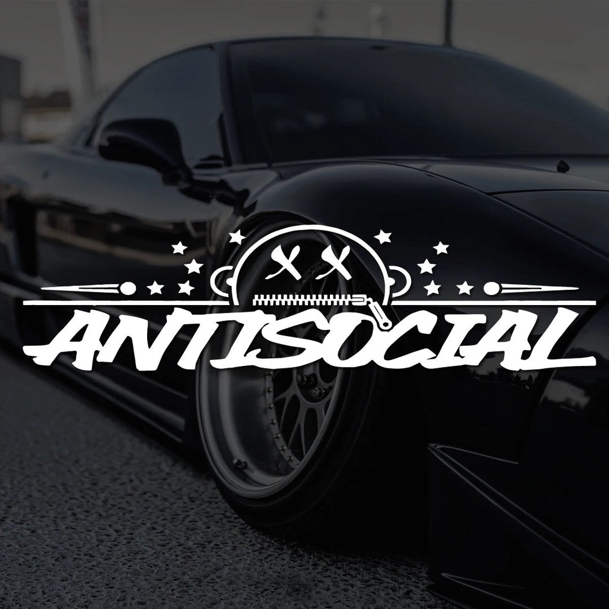 White Antisocial banner decal shown over a black stanced coupe