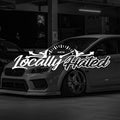 White Locally Hated banner decal shown over a silver Subaru WRX
