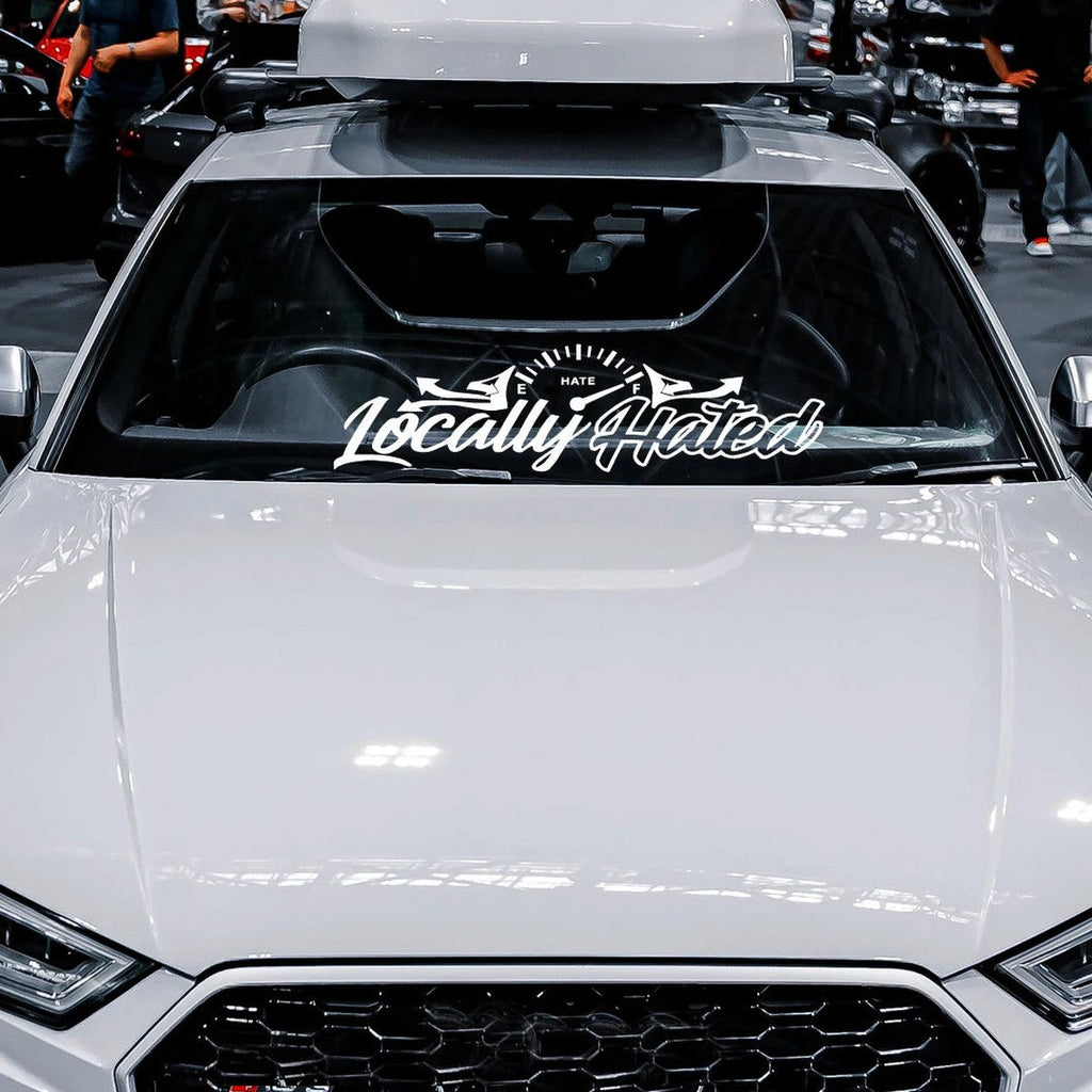 Locally Hated windshield banner decal on a white Audi