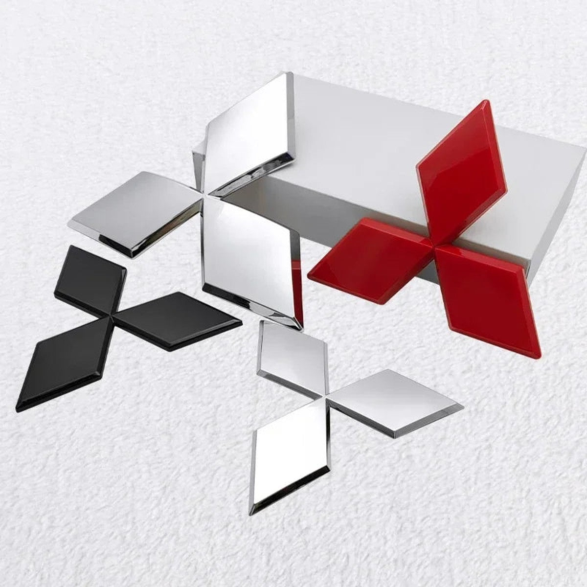Black, silver and red three-diamond ABS emblems