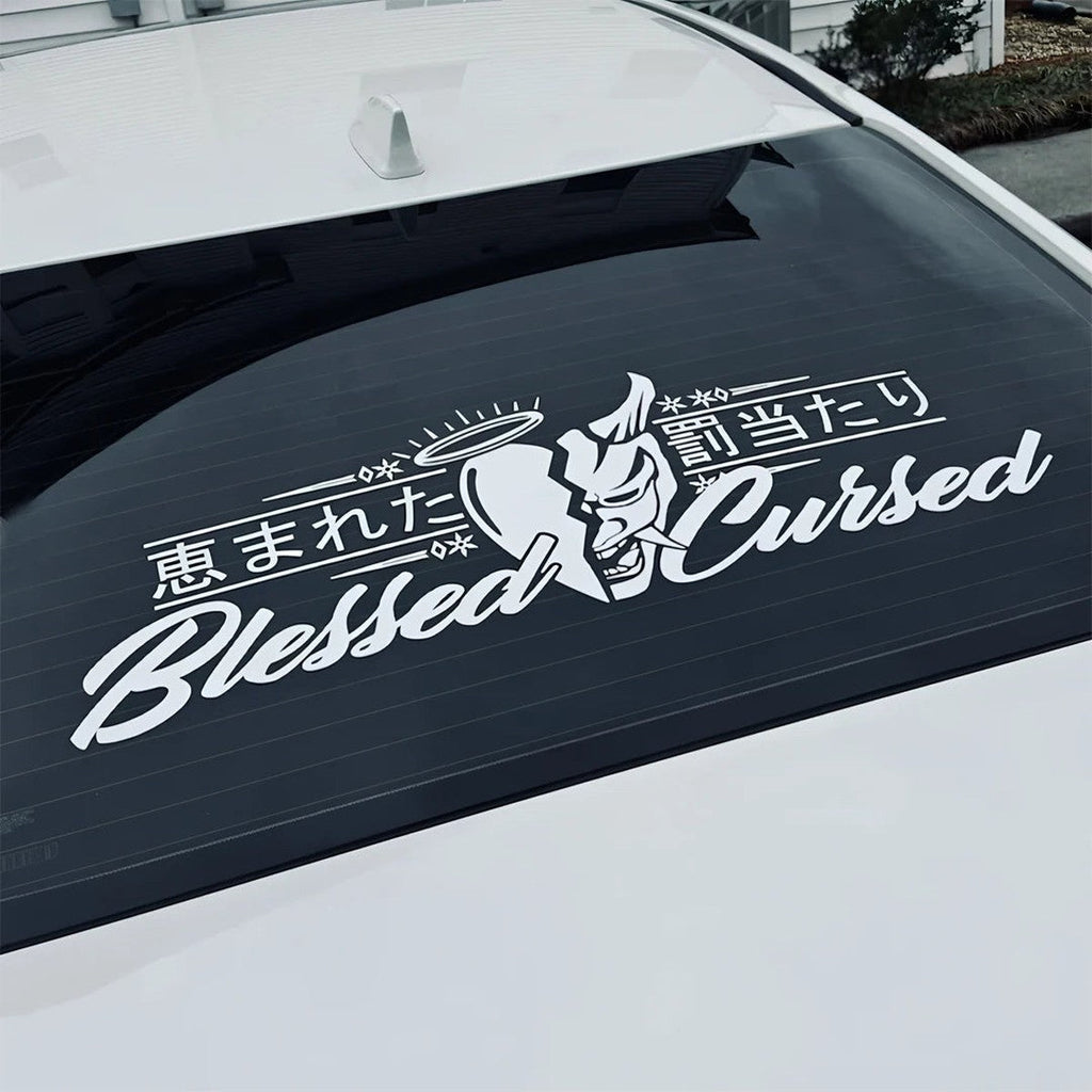 White Blessed and Cursed oni kanji banner decal on a white car rear window