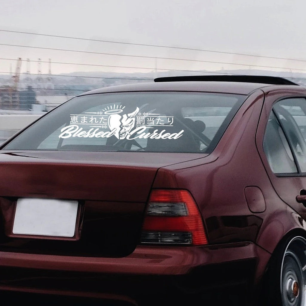 Oni kanji rear window banner decal on a red sedan