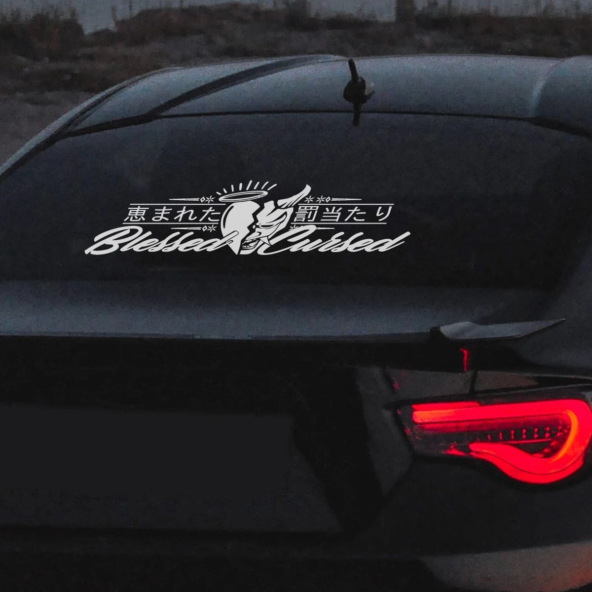 Oni kanji rear window banner decal on a dark sports car