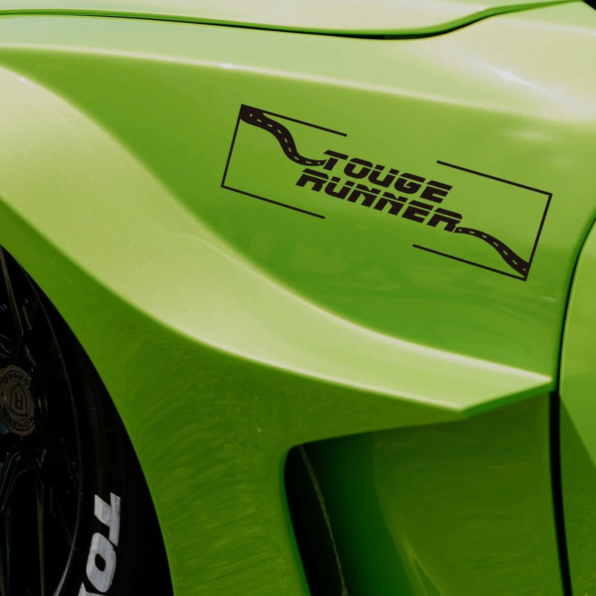 Black Touge Runner decal on a lime green widebody car