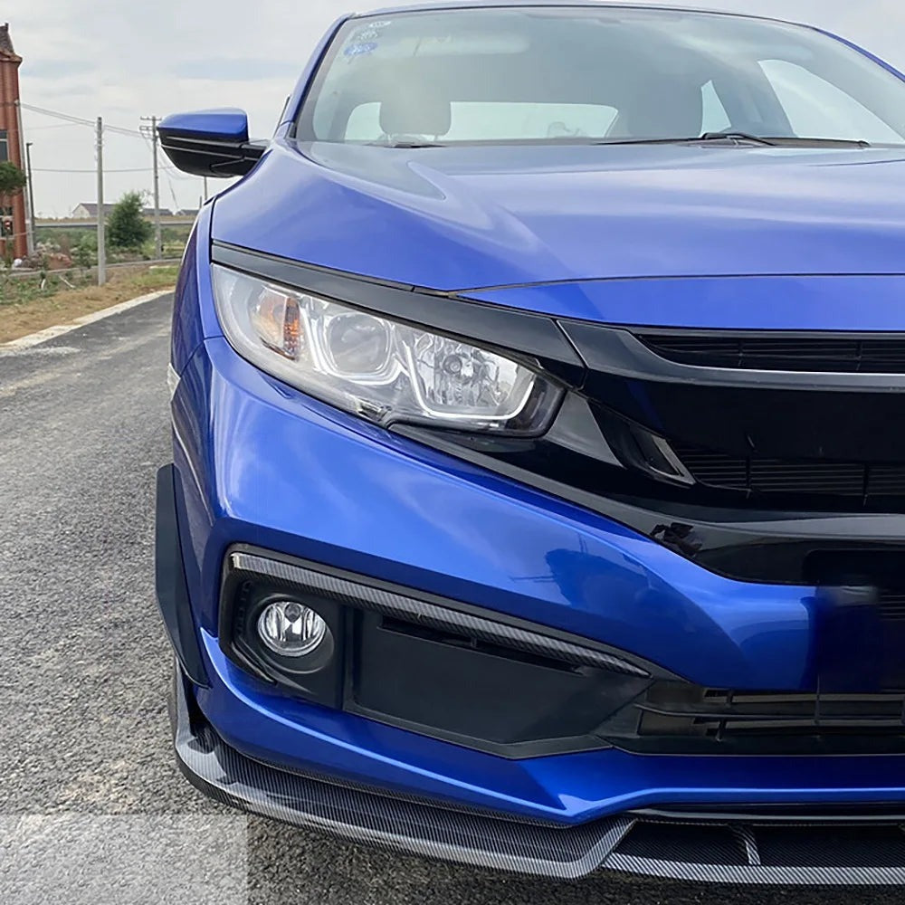 Close-up of the front bumper corner on a blue 10th gen Civic
