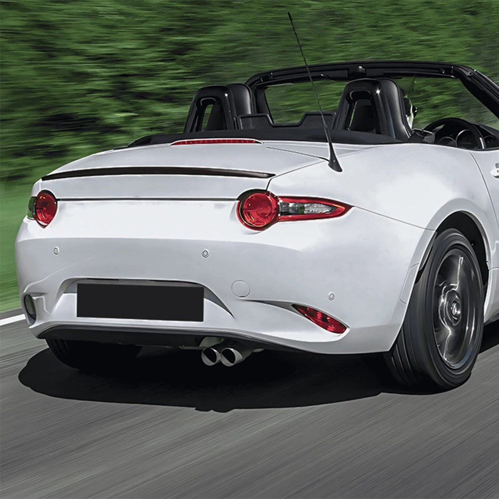 Gloss black trunk lip spoiler installed on a white MX-5 Miata ND
