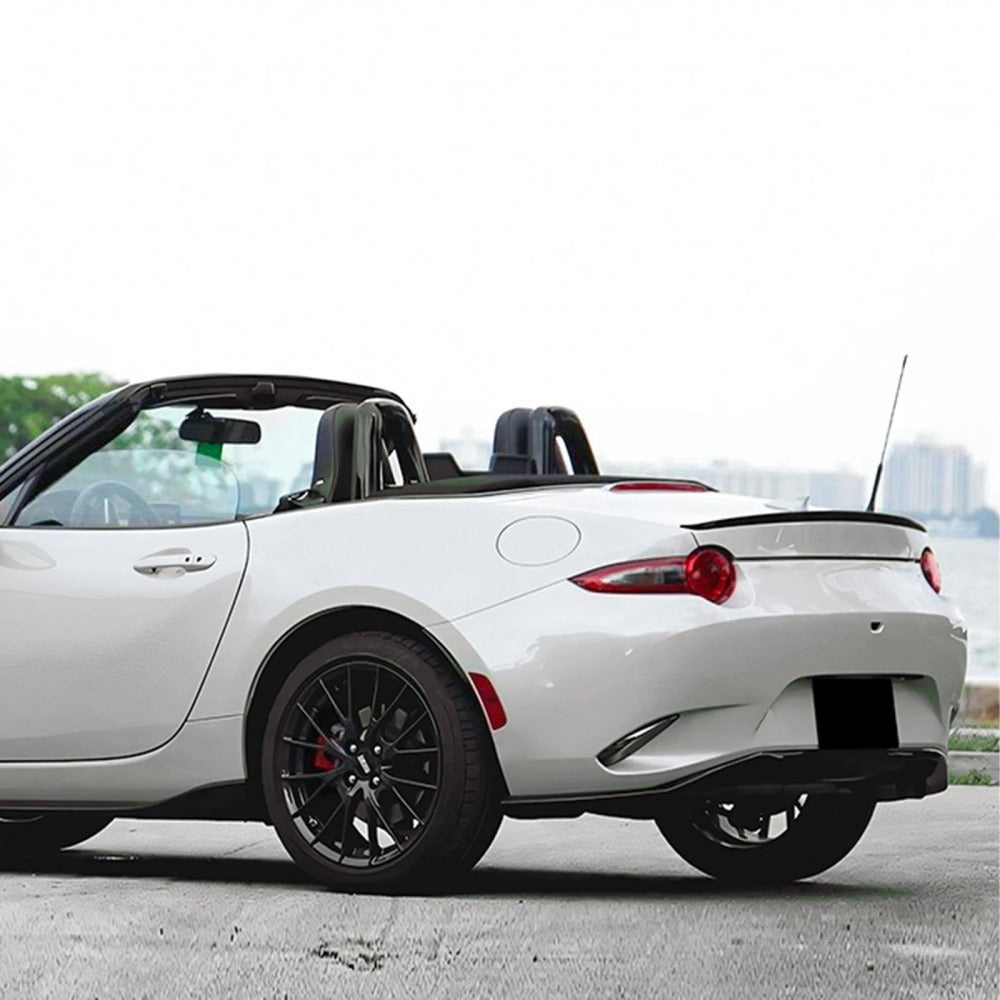 Trunk lip spoiler installed on a white MX-5 Miata ND, side view