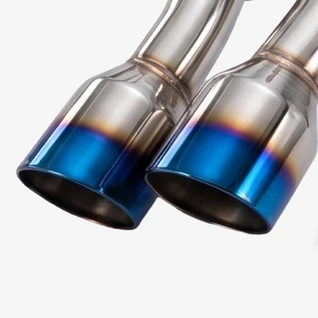 Close-up of the dual burnt-blue stainless steel exhaust tips and welds